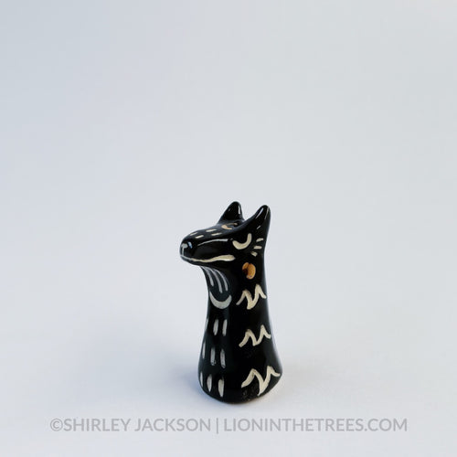 Small black sgraffito wolf totem.